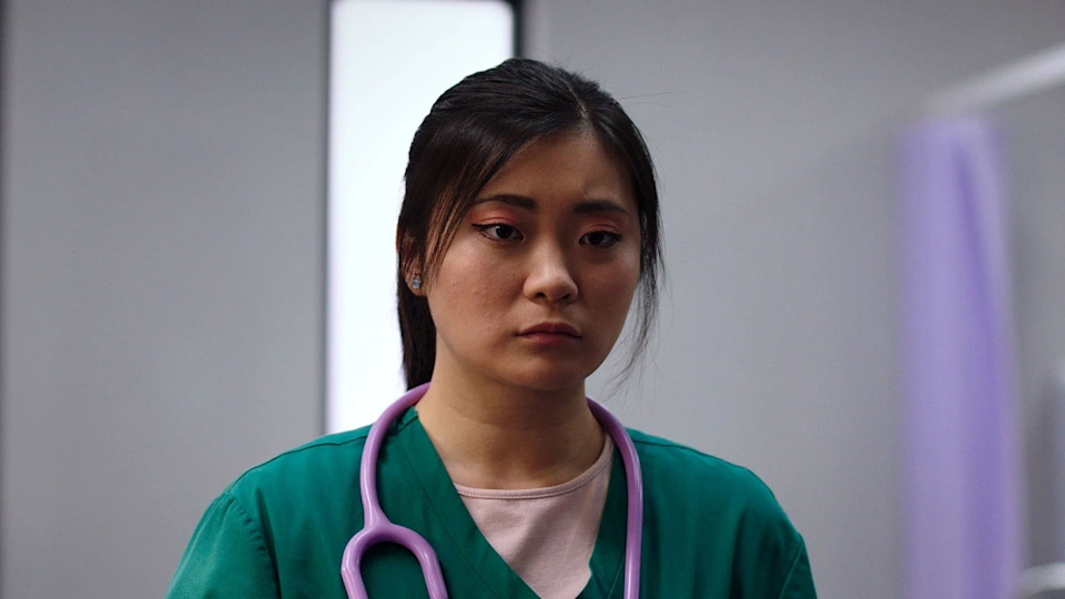 Behind the Smile: Kim Chang’s Secret Battle Sends Shockwaves Through Holby